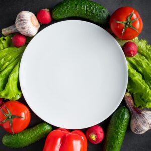 Fresh vegetables on a dark background. The concept of healthy nutrition and diet.