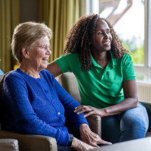 Helper caring for elderly lady