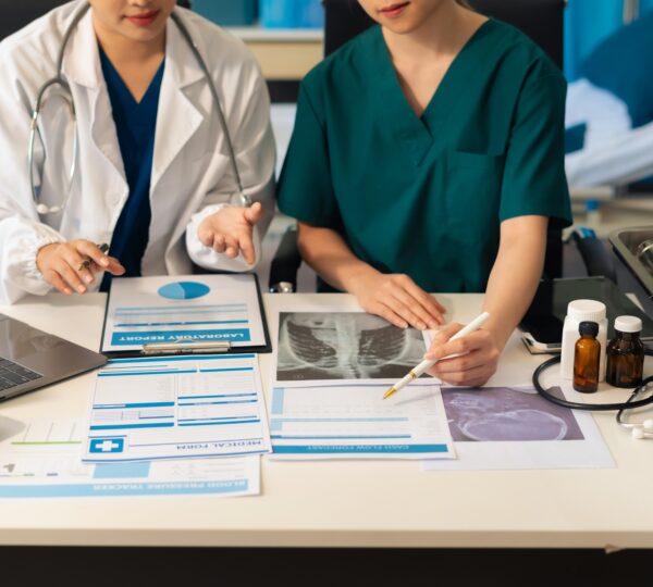 Medical team working analyzed the results of medical reports.